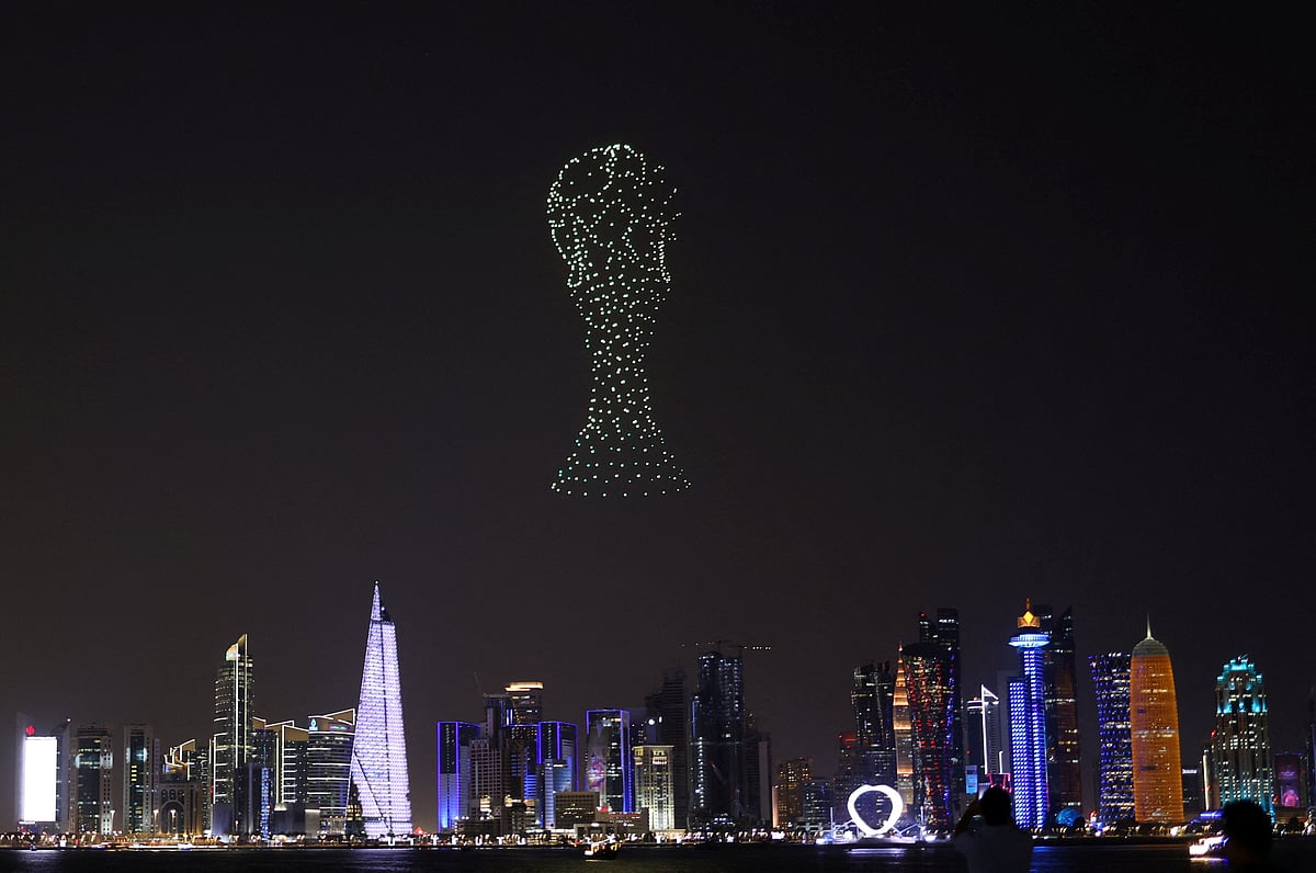 A drone show depicting the FIFA World Cup trophy is seen above the Doha skyline, ahead of the FIFA World Cup 2022 in Doha, Qatar 14 November, 2022