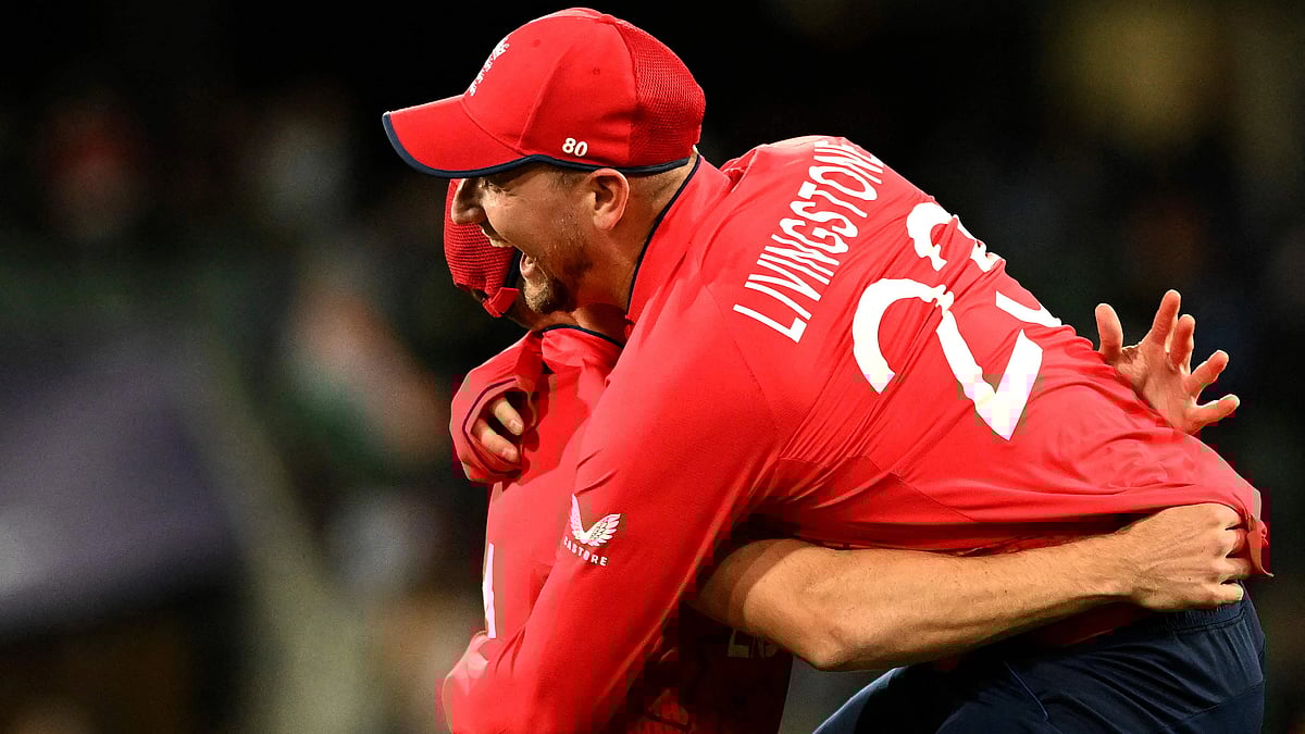 England's Liam Livingstone (R) celebrates win with a teammate after the ICC men's Twenty20 World Cup 2022 semi-final cricket match between England and India at The Adelaide Oval on 10 November 2022 in Adelaide.