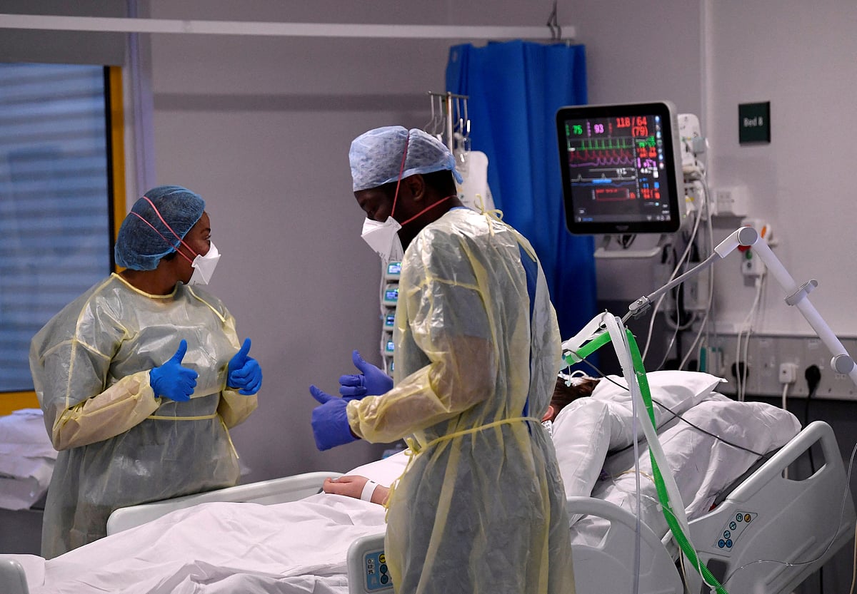 Nurses react as they treat a COVID-19 patient in the ICU (Intensive Care Unit) at Milton Keynes University Hospital, amid the spread of the coronavirus disease (COVID-19) pandemic, Milton Keynes, Britain, January 20, 2021