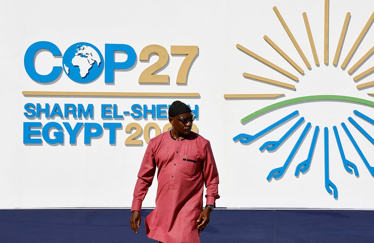 A man walks outside of the Sharm El Sheikh International Convention Centre during the COP27 climate summit opening in Egypt's Red Sea resort of Sharm el-Sheikh, Egypt 6 November 2022.