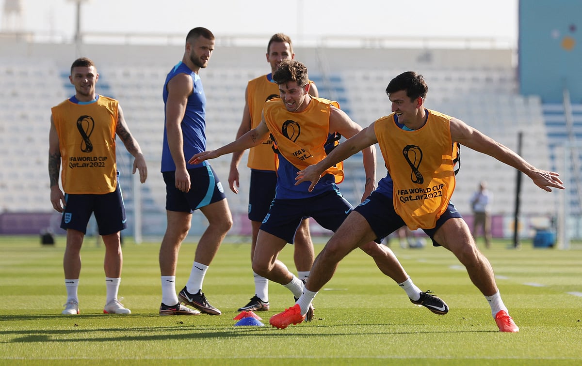 England's John Stones and Harry Maguire during a training session at the Al Wakrah SC stadium in Al Wakrah, Qatar on 24 November, 2022