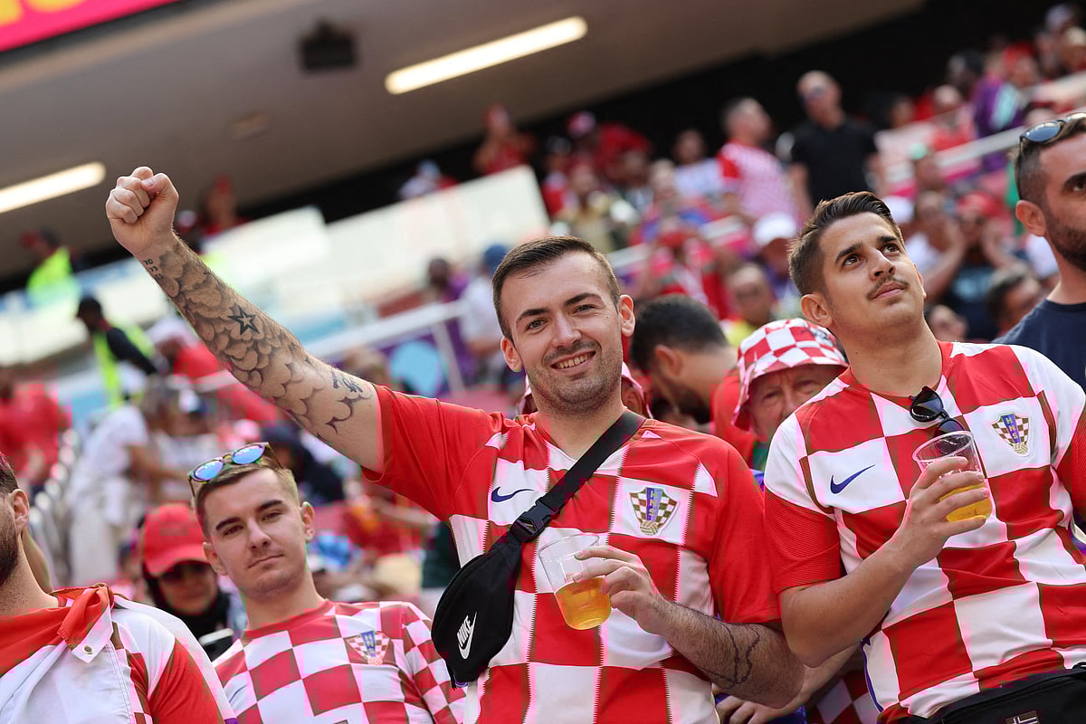 Croatia fans hold alcohol-free Budweiser Zero's inside the stadium