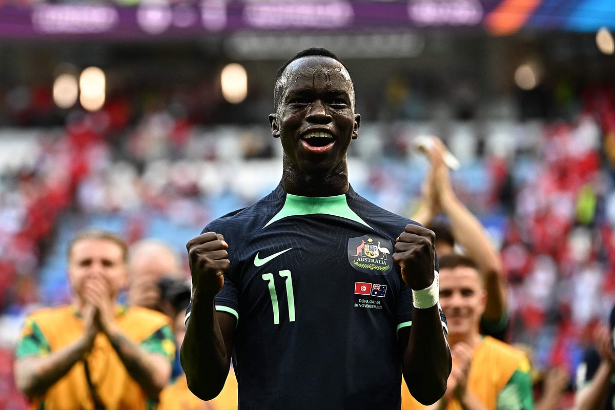 Australia's forward #11 Awer Mabil celebrates after winning the Qatar 2022 World Cup Group D football match between Tunisia and Australia at the Al-Janoub Stadium in Al-Wakrah, south of Doha on 26 November 2022