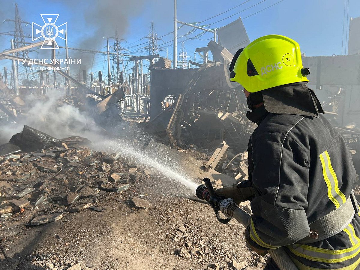 Firefighters work to put out a fire at energy infrastructure facilities, damaged by Russian drone strike, as Russia's attack on Ukraine continues, in Kyiv region, Ukraine 31 October, 2022.