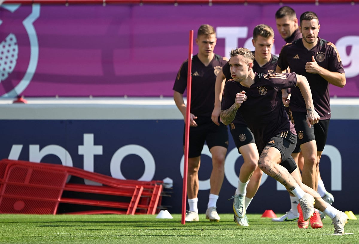 Germany's defender David Raum (C) and teammates attend a training session at the Al Shamal Stadium in Al Shamal, north of Doha on 22 November, 2022