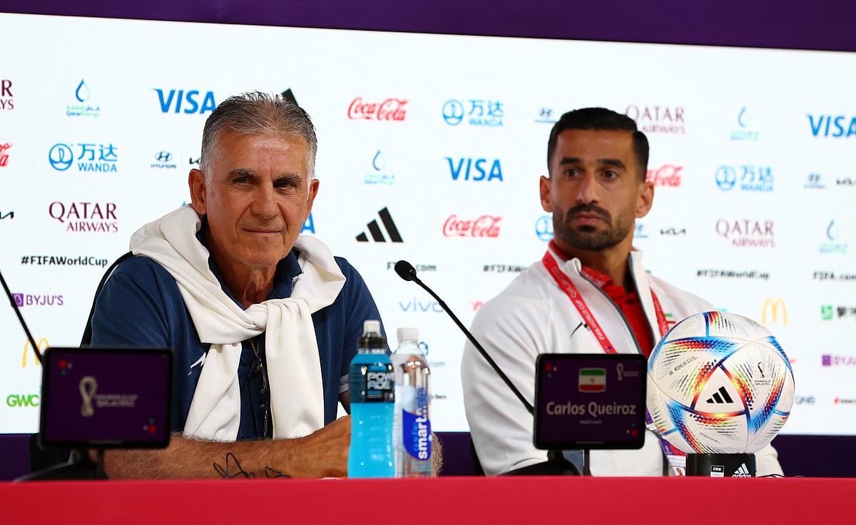 Iran coach Carlos Queiroz and Ehsan Hajisafi during a press conference at the Main Media Center, Doha, Qatar on 20 November, 2022
