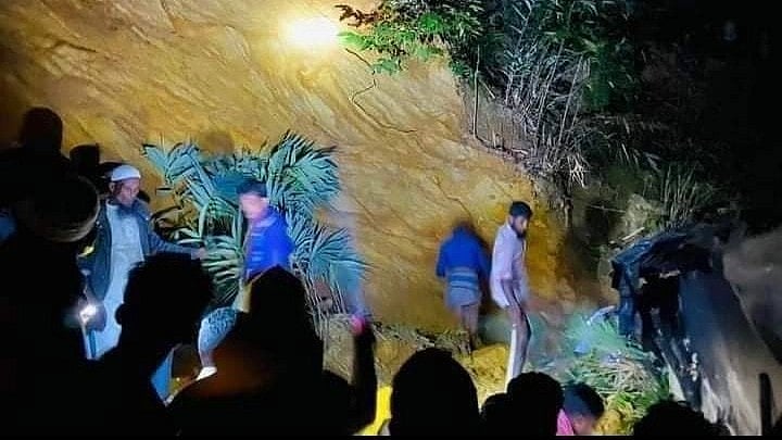 Local people are seen at the spot of landslide in Ramu, Cox's Bazar