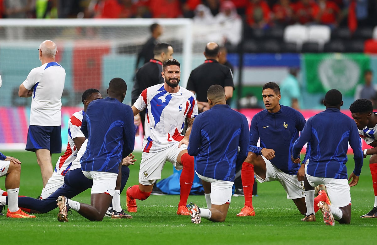 France's Olivier Giroud, Raphael Varane and teammates during the warm up before the semi-final match against Morocco.