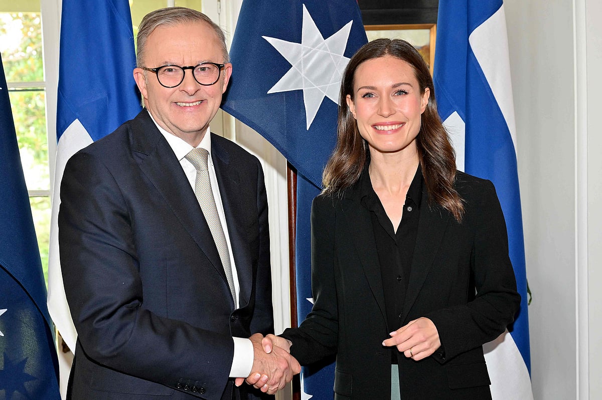 Australian Prime Minister Anthony Albanese (L) shakes hands with Finland’s Prime Minister Sanna Marin during their meeting at Kirribilli House in Sydney on 2 December, 2022