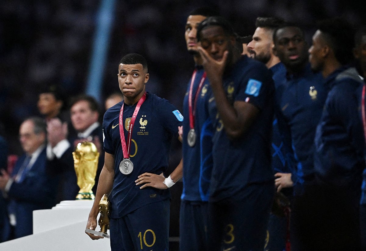 France's Kylian Mbappe reacts after receiving the runners up medal and the Golden Boot award after the FIFA World Cup 2022 final between Argentina and France at the Lusail Stadium in Lusail, Qatar on 18 December, 2022