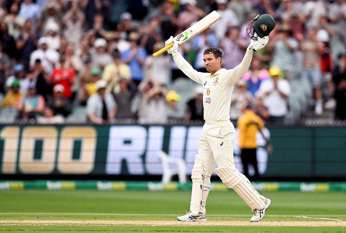 Australian batsman Alex Carey celebrates scoring his century with teammate Cameron Green on the third day of the second Test between Australia and South Africa at the MCG in Melbourne on 28 December, 2022