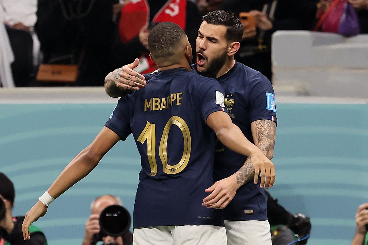 France's defender #22 Theo Hernandez (R) celebrates with France's forward #10 Kylian Mbappe after scoring his team's first goal during the Qatar 2022 World Cup semi-final football match between France and Morocco at the Al-Bayt Stadium in Al Khor, north of Doha on 14 December, 2022