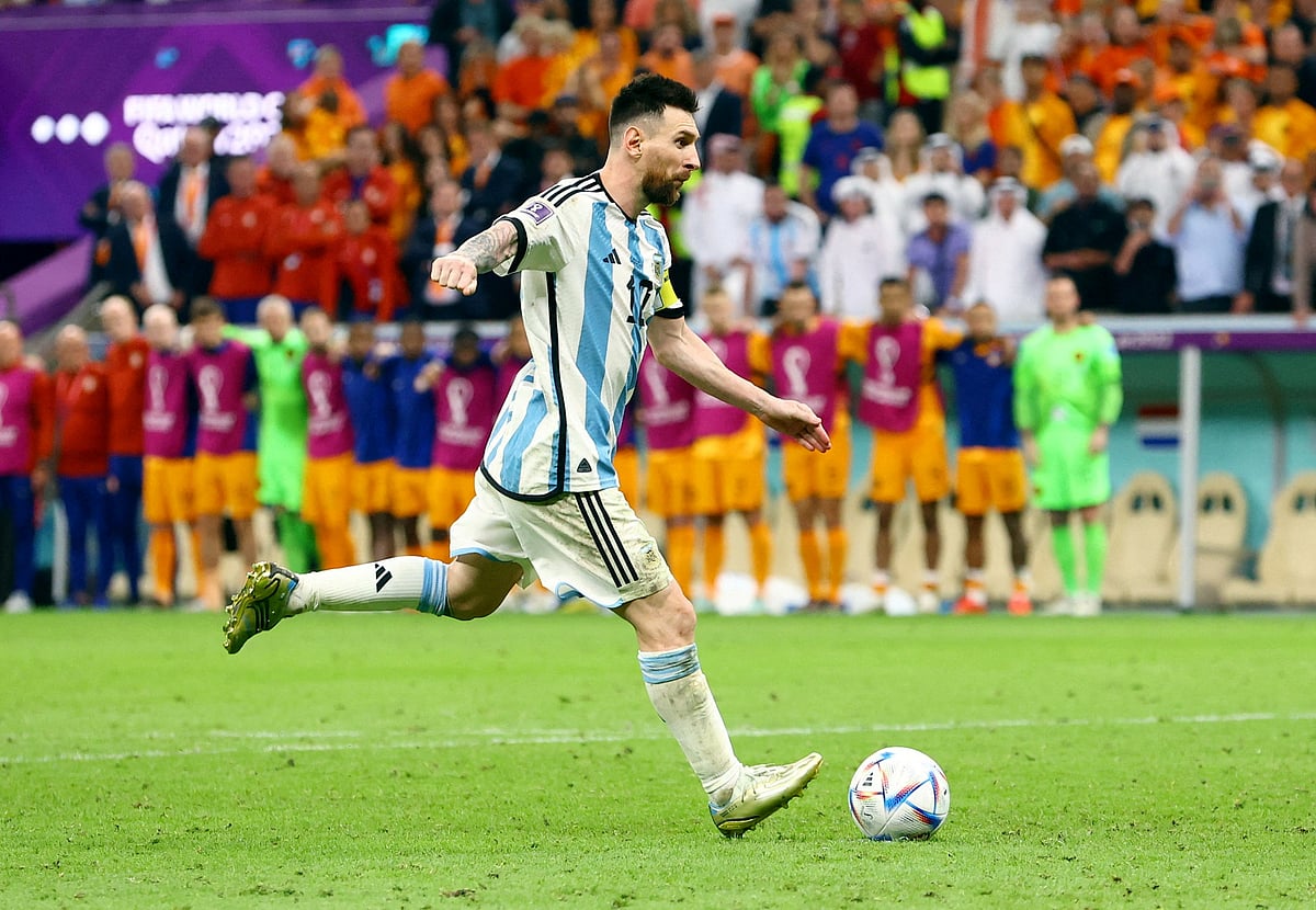 Argentina's Lionel Messi scores a penalty during a penalty shootout in the FIFA World Cup 2022 quarter final match of Netherlands v Argentina at the Lusail Stadium, in Lusail, Qatar on 10 December, 2022