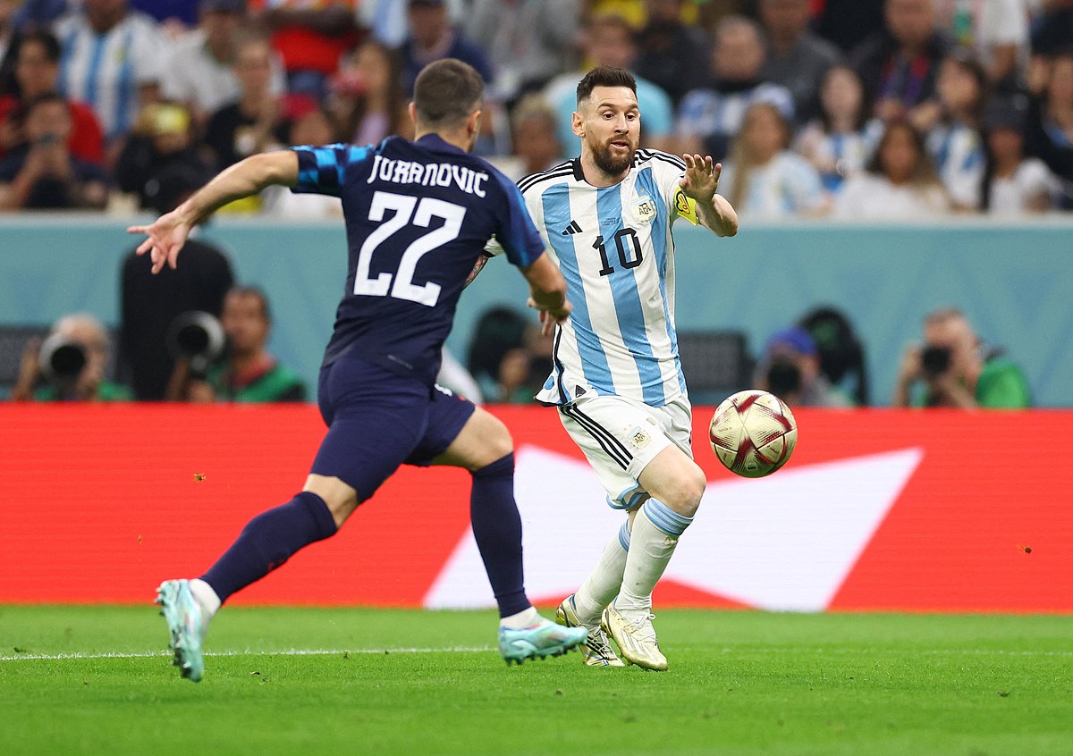 Argentina's Lionel Messi in action with Croatia's Josip Juranovic