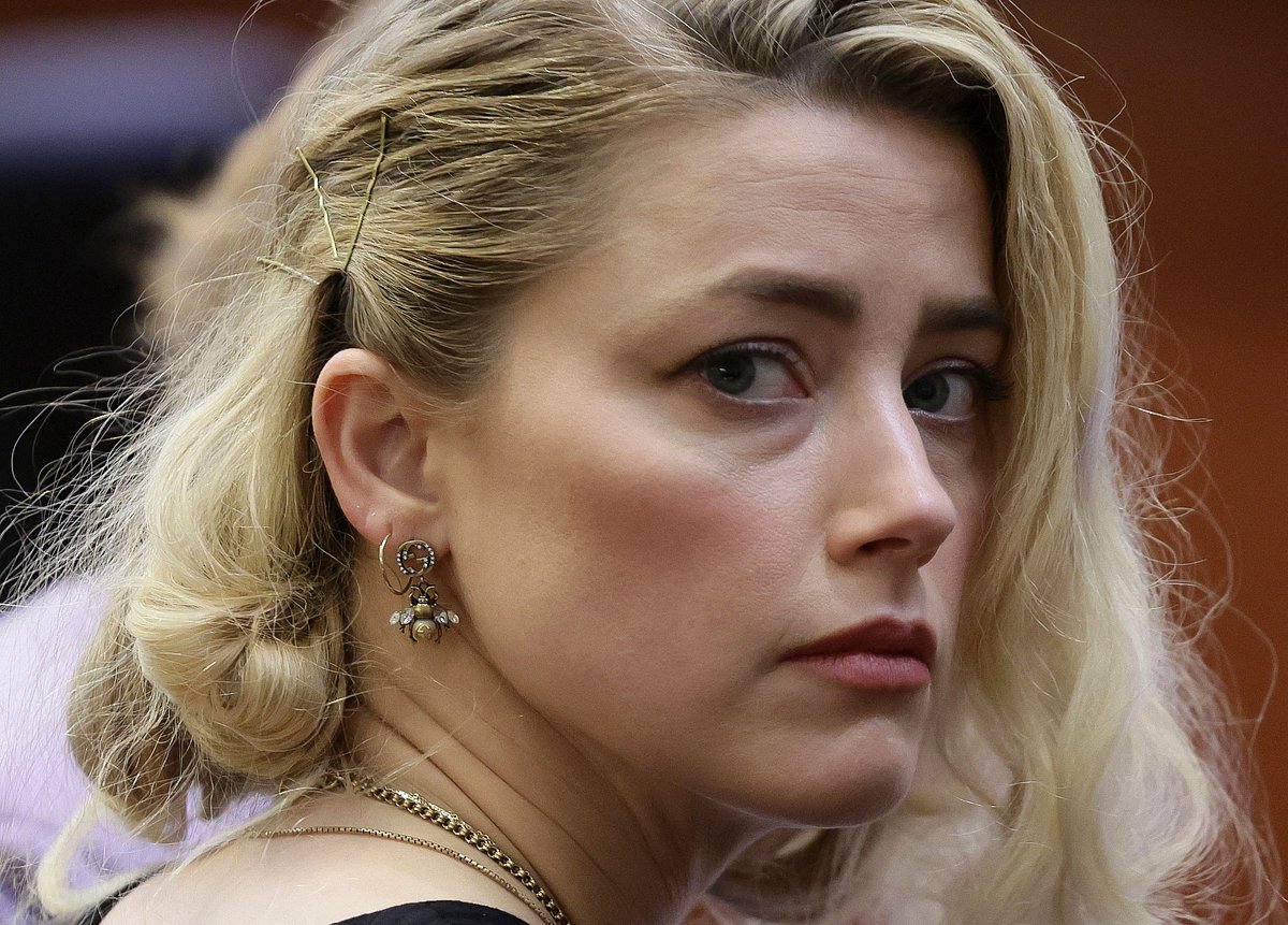 In this file photo taken on 1 June, 2022 actor Amber Heard waits before the jury said that they believe she defamed ex-husband Johnny Depp while announcing split verdicts in favor of both her ex-husband Johnny Depp and Heard on their claim and counter-claim in the Depp v. Heard civil defamation trial at the Fairfax County Circuit Courthouse in Fairfax, Virginia.