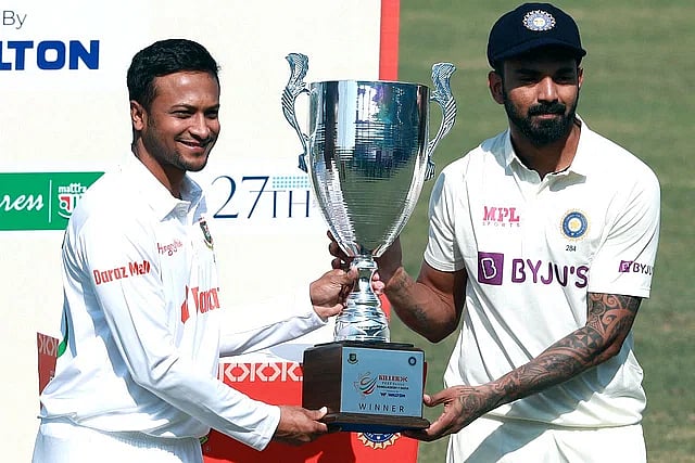 Bangladesh captain Shakib Al Hasan an India captain KL Rahul pose with the trophy of the forthcoming two-Test series