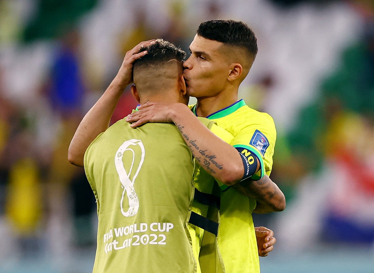 Brazil's Thiago Silva and teammate look dejected after being eliminated from the World Cup
