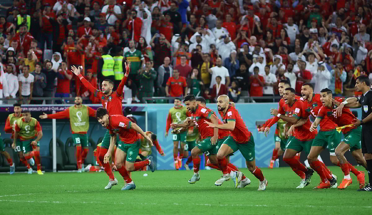 Morocco players celebrate win against Spain in the last 16 match of World Cup