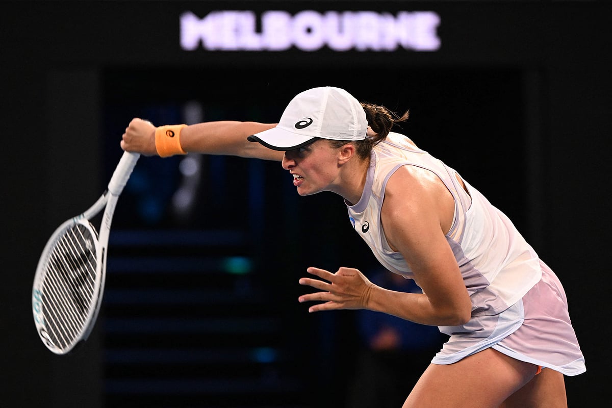 Poland's Iga Swiatek hits a return against Germany's Jule Niemeier during their women's singles match on day one of the Australian Open tennis tournament in Melbourne on 16 January, 2023