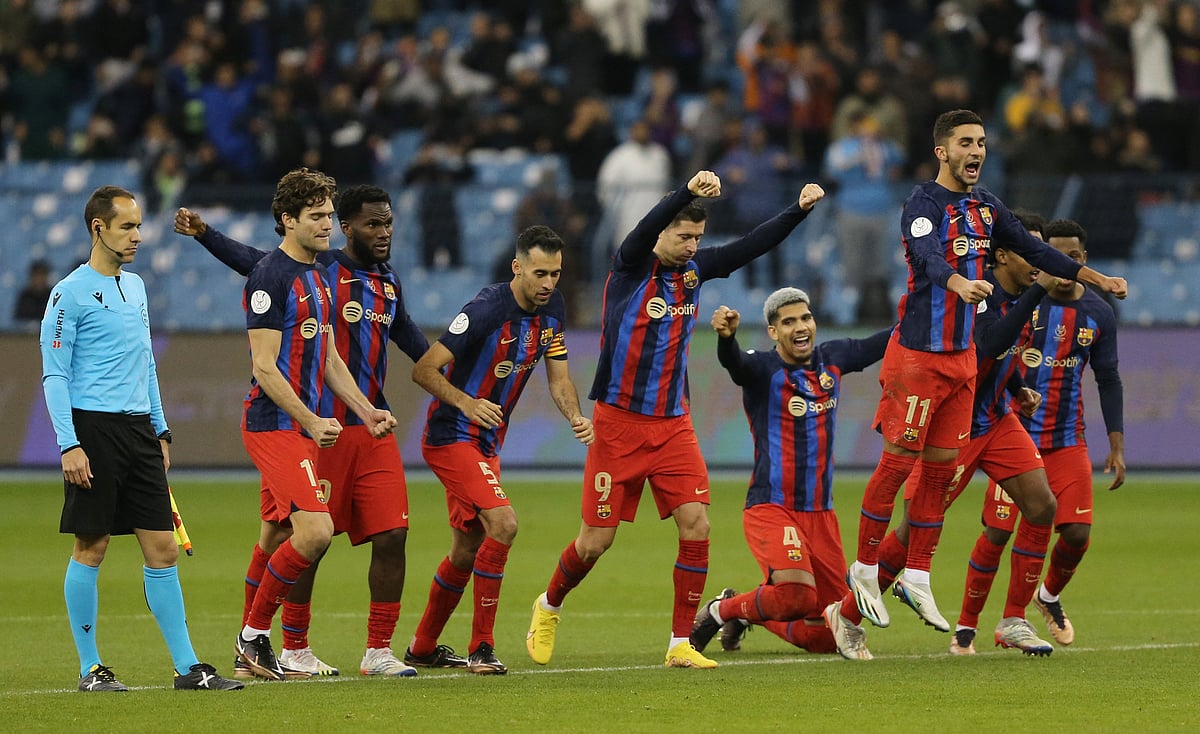 FC Barcelona players celebrate after winning the penalty shootout in the Spanish Super Cup semi final against Real Betis at the King Fahd Stadium in Riyadh, Saudi Arabia on 13 January, 2023