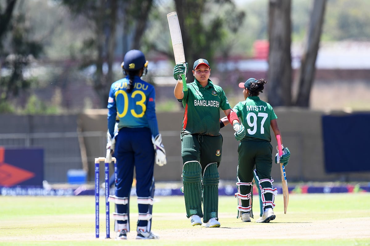 Bangladesh's Afia Prottasha raises her bat after completing her fifty against Sri Lanka at the Group A match of the ICC Under-19 Women's Twenty20 World Cup in Benoni, South Africa on 16 January, 2023