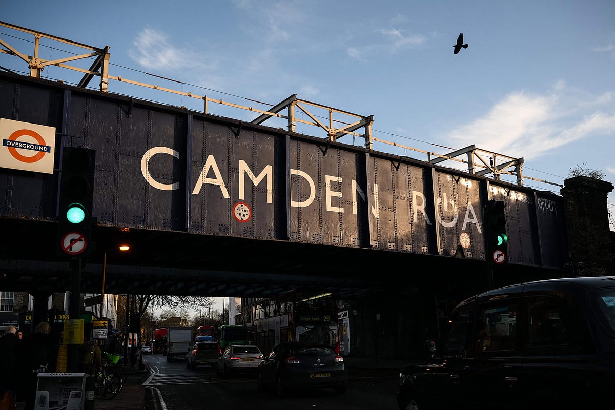 Vehicles are driven under a railway crossing bridge where the proposed "Camden high line" construction project would take place, in Camden, north London, on 11 January, 2023. London is on track to transform a disused stretch of elevated railway in the heart of the city into a "park in the sky", emulating similar successful schemes in Paris and New York.