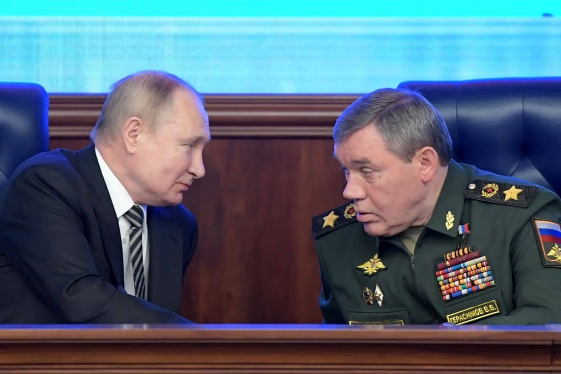 Russian President Vladimir Putin listens to Chief of the General Staff of the Russian Armed Forces Valery Gerasimov during the annual meeting of the defence ministry board in Moscow in December.