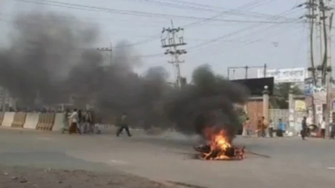 Locals set two motorcycles on fire in protest of a trader allegedly losing his life in police custody in Gazipur on 18 January, 2023