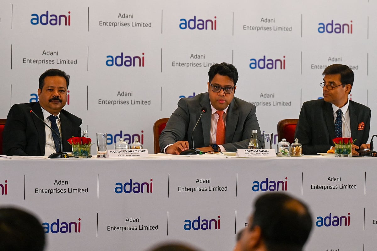 Adani Enterprises Limited group board members (L-R) executive vice president Raghwendra Pande, corporate finance head Anupam Misra (C) and head of finance of Adani airport holding ltd. Rakesh Tiwari attend a news conference to announce the company’s forthcoming Follow-on Public Offering (FPO), in Mumbai on 19 January, 2023