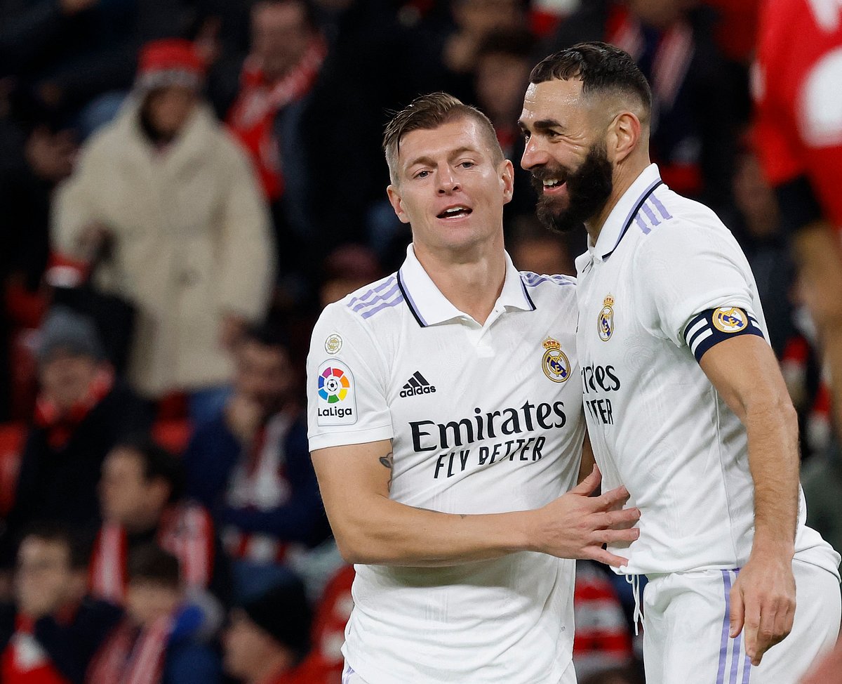 Real Madrid's Toni Kroos celebrates with Karim Benzema after scoring their second goal in their LaLiga match against Athletic Bilbao at the San Mames in Bilbao, Spain on 22 January, 2023