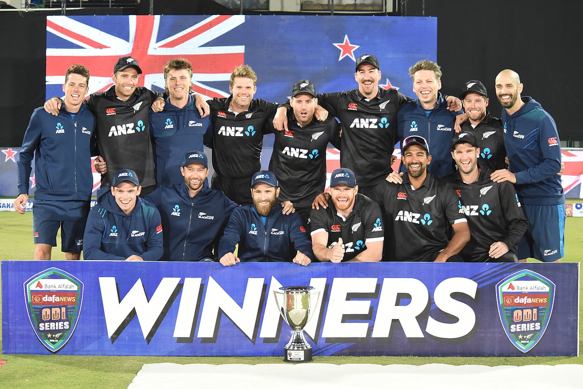 New Zealand’s players pose with the winners' trophy on the third and final one-day international (ODI) cricket match between Pakistan and New Zealand at the National Stadium in Karachi on 13 January, 2023.