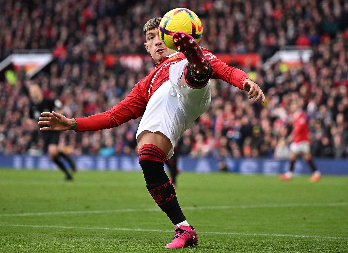 Manchester United's Argentinian defender Lisandro Martinez clears the ball during the English Premier League football match between Manchester United and Manchester City at Old Trafford in Manchester, north west England, on January 14, 2023