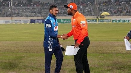 Dhaka Dominators captain Nasir Hossain and Khulna Tigers captain Yasir Ali shake hands after the toss ahead of their BPL9 match at the Sher-e-Bangla National Cricket Stadium in Dhaka on 24 January, 2023
