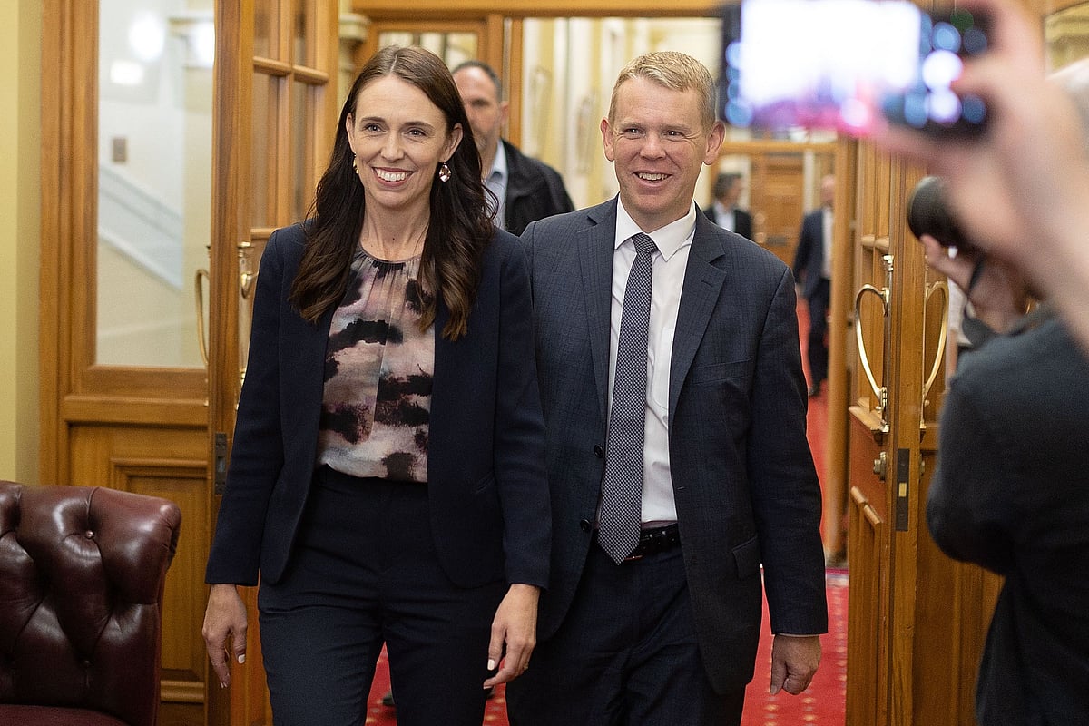 New Zealand Prime Minister Jacinda Ardern (L) and Chris Hipkins arrive at the Labour caucus meeting to elect a new premier at Parliament in Wellington on 22 January, 2023