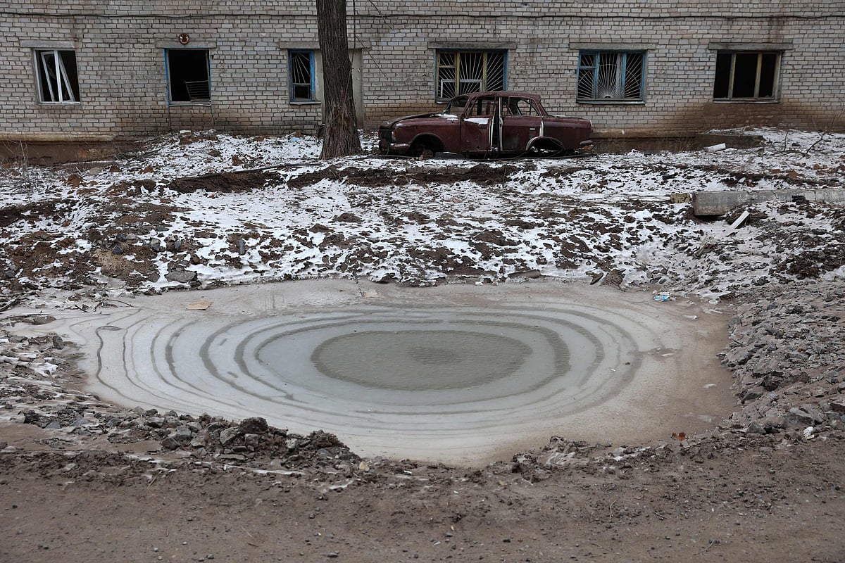 Ice covers a bomb crater in town of Siversk, Donetsk region on 13 January, 2023, as the Russia-Ukraine war enters its 324th day.