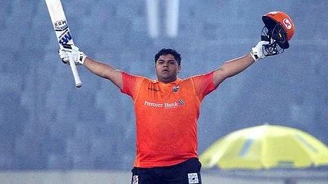 Khulna Tigers batsman Azam Khan celebrates after scoring the first century of the ninth edition of Bangladesh premier League at the Sher-e-Bangla National Cricket Stadium in Dhaka on 9 January, 2023