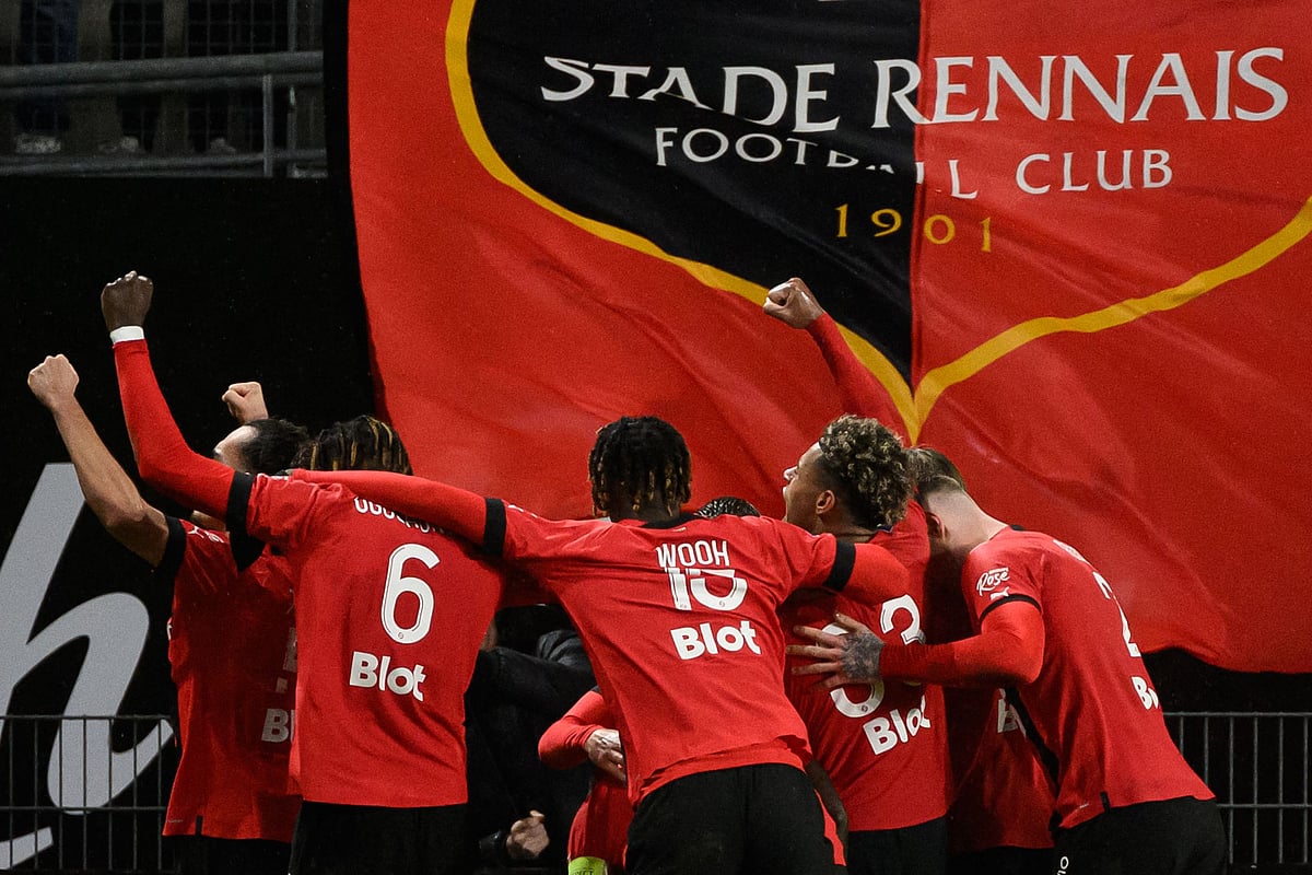 Rennes' Malian defender Hamari Traore (hidden) is congratulated by teammates after scoring a goal during the French L1 football match between Stade Rennais FC and Paris Saint-Germain (PSG) at the Roazhon Park stadium in Rennes, western France, on 15 January, 2023