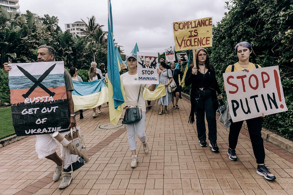 Protesters from Ukrainian Association of SA and civil society activists take part in a demonstration at the Umhlanga beach in Durban on 18 February, 2023