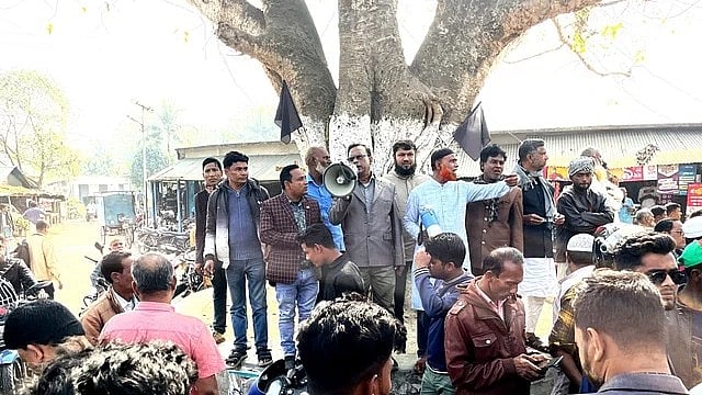 Chhatni union Awami League president Dulal Sarker addressing the peace rally after taking over BNP’s for march Madrasah Ghat Battala area on Saturday