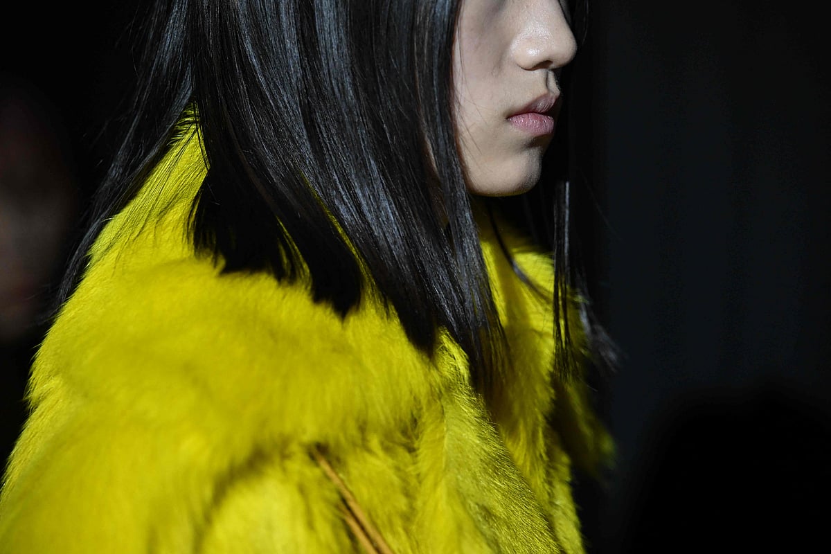 Models wearing creations by Proenza Schouler gather backstage prior to their runway show during New York Fashion Week on 11 February, 2023.