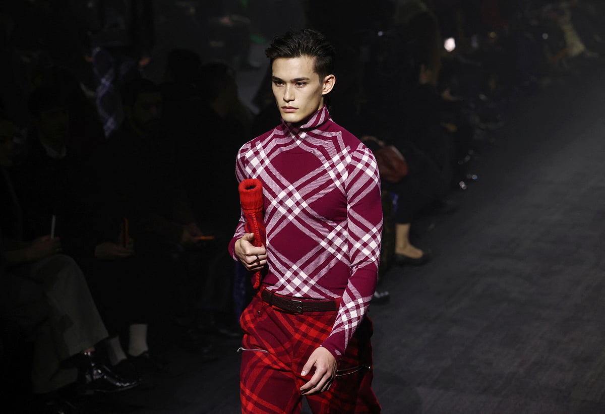 A model presents a creation at the Burberry catwalk show during London Fashion Week in London, Britain, 20 February, 2023.
