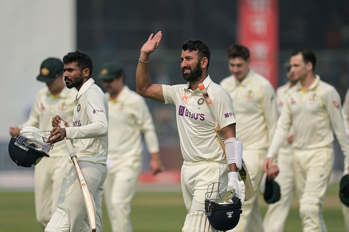 India's Cheteshwar Pujara waves towards the spectators as he walks off the field after India's win in the second Test between India and Australia at the Arun Jaitley Stadium in New Delhi on 19 February, 2023