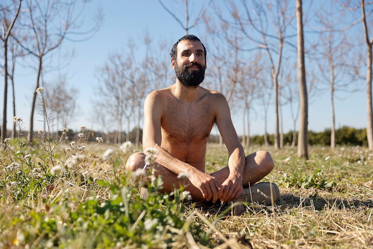 Alejandro Colomar poses naked in his vegetable garden, as Spanish court has ruled in favour of allowing him to continue walking around his village naked, as he has been doing since 2020, in Aldaia, near Valencia, Spain, February 3, 2023