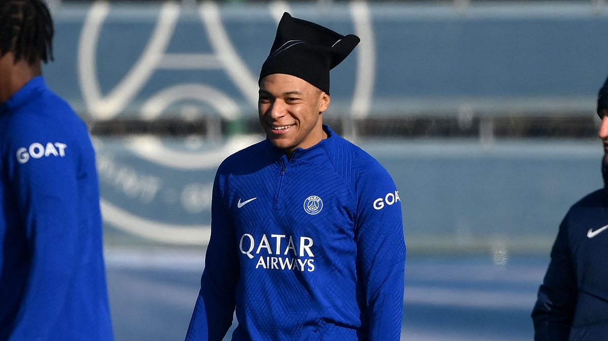 Paris Saint-Germain's French forward Kylian Mbappe (C) takes part in a training session in Saint-Germain-en-Laye, west of Paris on 13 February, 2023