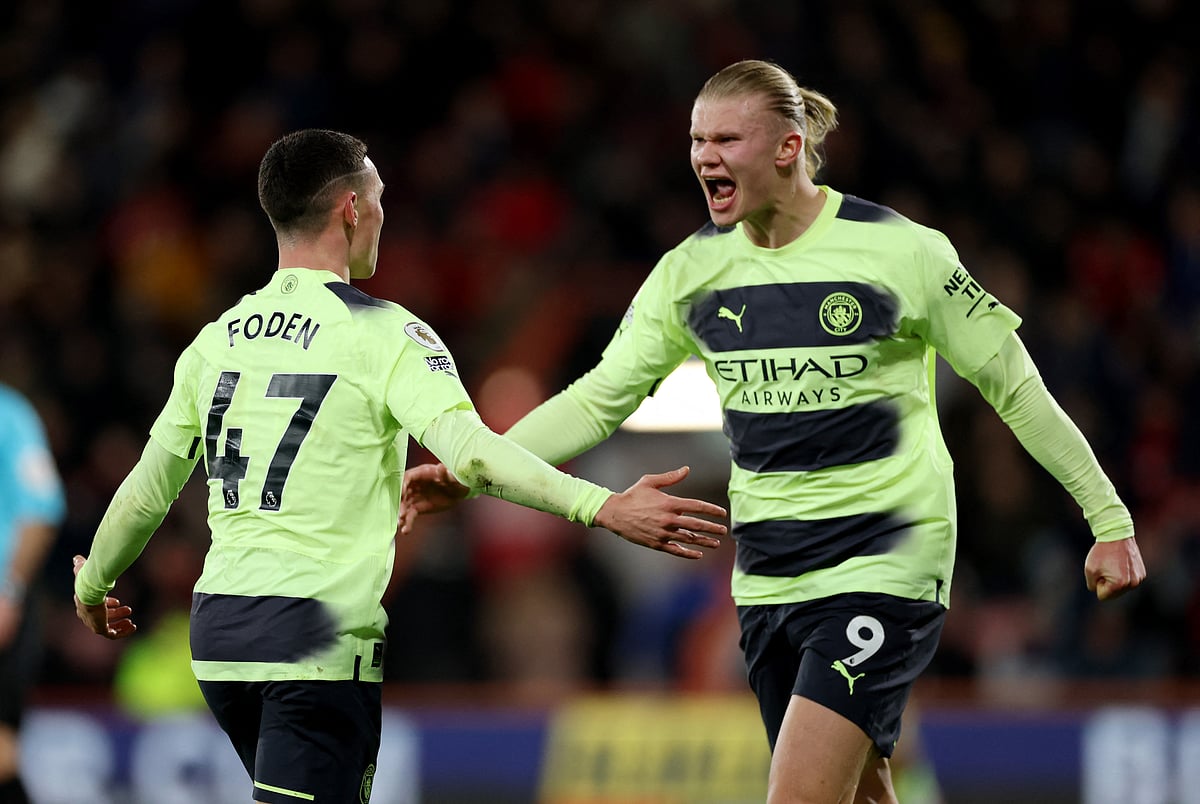 Manchester City's Phil Foden celebrates scoring their third goal with Erling Braut Haaland in their English Premier League match against AFC Bournemouth at the Vitality Stadium in Bournemouth, Britain on 25 February 2023