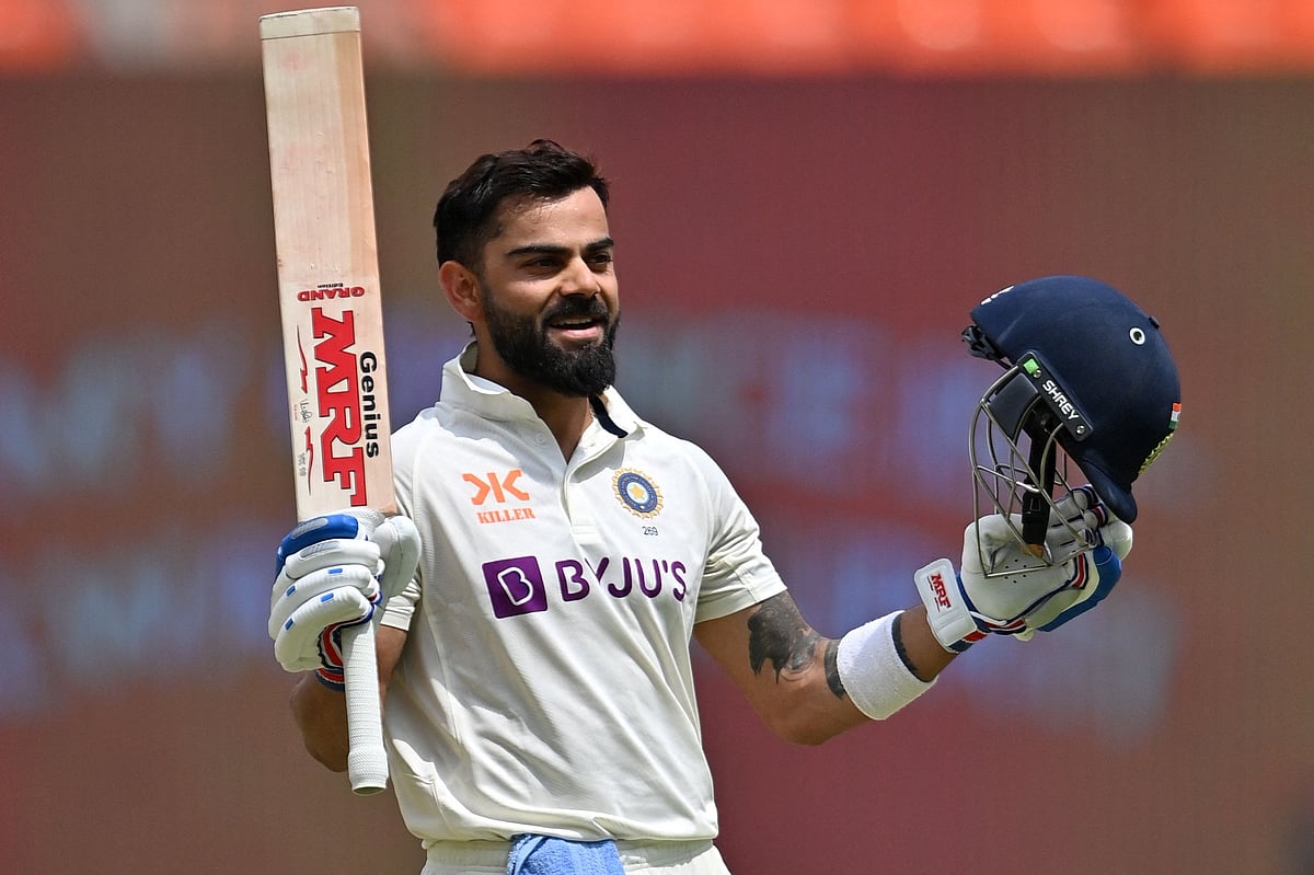 India's Virat Kohli celebrates after scoring a century (100 runs) during the fourth day of the fourth and final Test cricket match between India and Australia at the Narendra Modi Stadium in Ahmedabad on 12 March, 2023