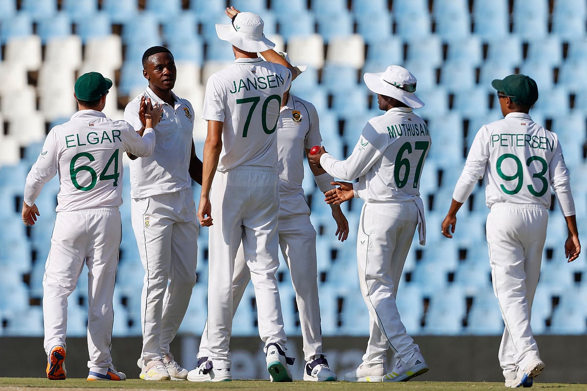 South Africa's Kagiso Rabada (2nd L) celebrates with teammates after the dismissal of West Indies' Kemar Roach (not seen) during the third day of the first Test cricket match between South Africa and West Indies at Supersport Park in Centurion on 2 March 2023.