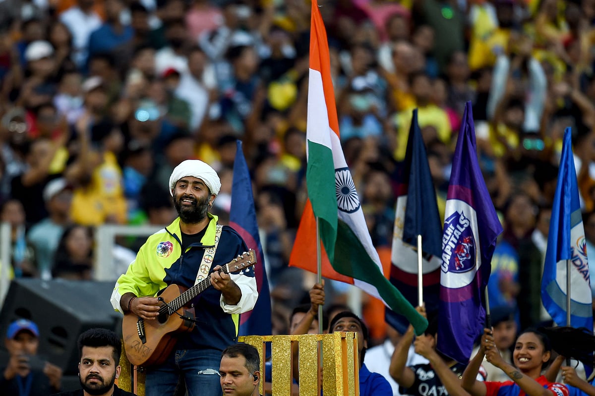 Bollywood singer Arijit Singh (L) performs for the opening ceremony before the start of first match of the Indian Premier League (IPL) Twenty20 cricket match between Gujarat Titans and Chennai Super Kings at the Narendra Modi Stadium in Ahmedabad on 31 March, 2023.