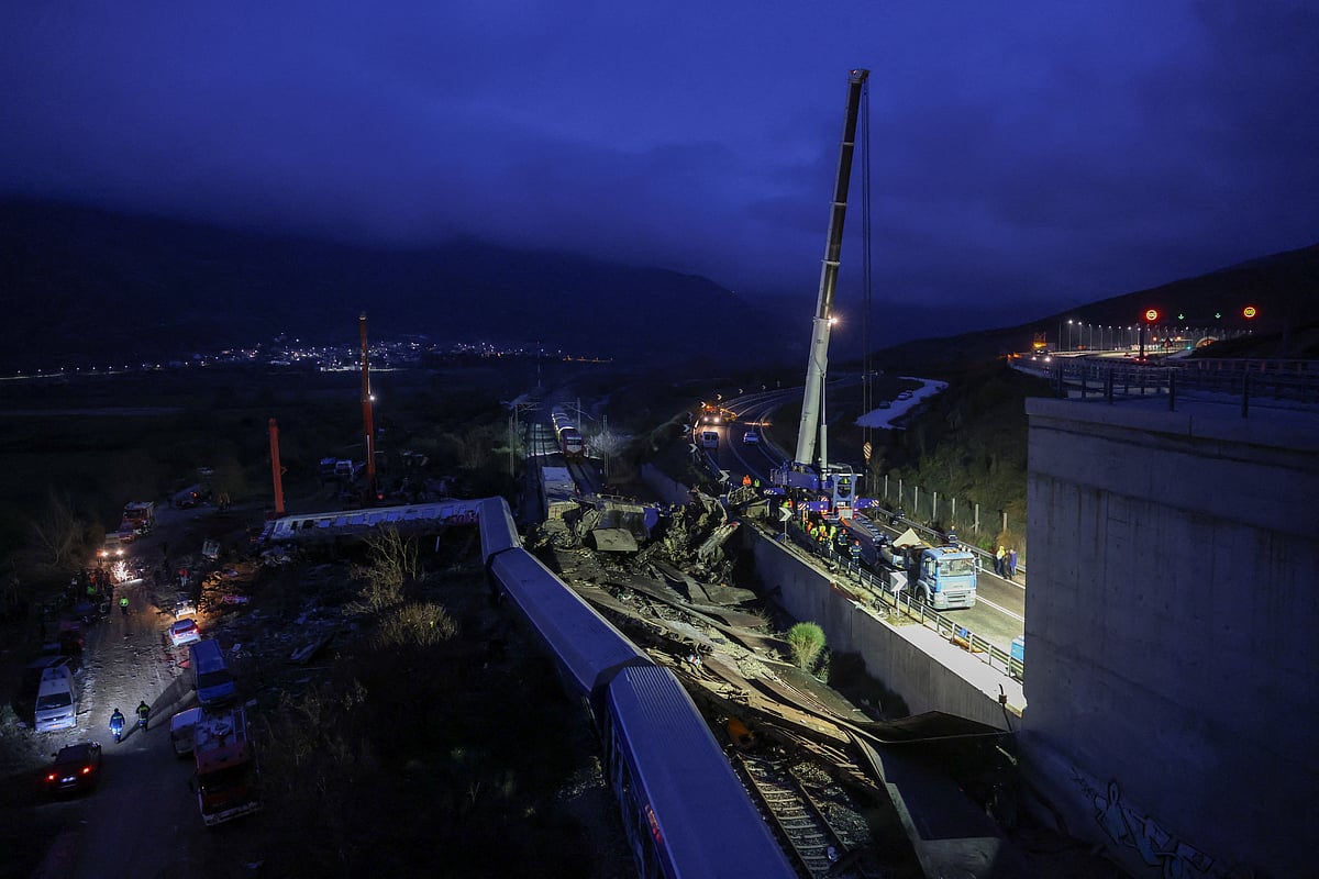Rescuers operate on the site of a crash, where two trains collided, near the city of Larissa, Greece, 1 March, 2023