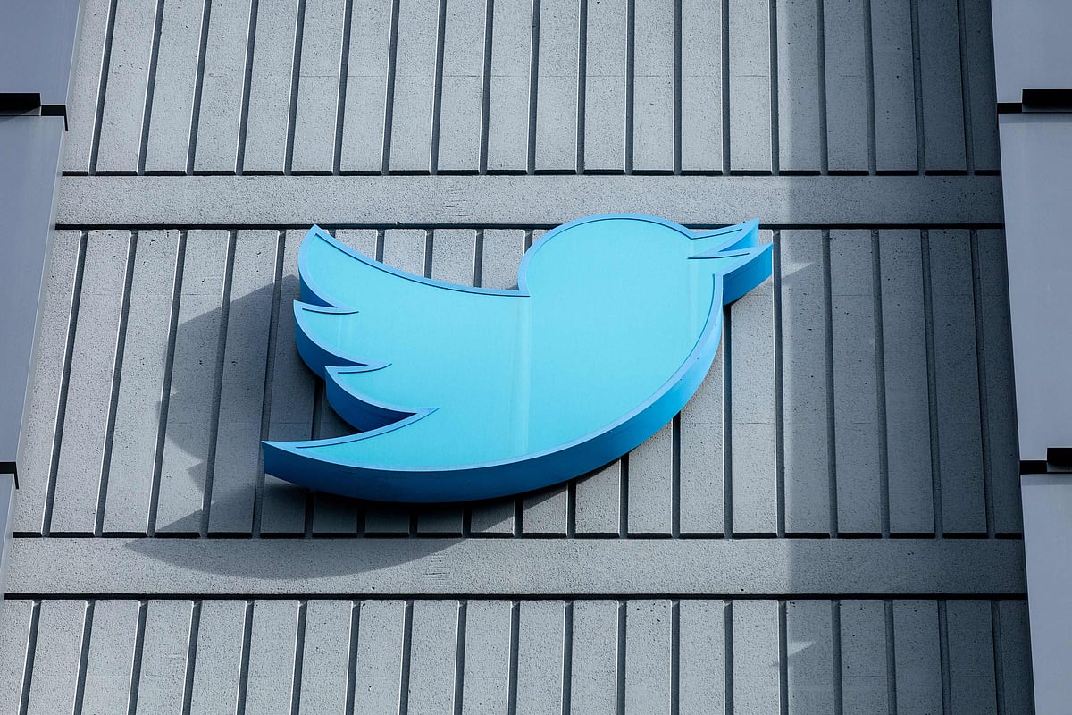 In this file photo taken on 28 October, 2022 the Twitter logo is seen on a sign on the exterior of Twitter headquarters in San Francisco, California.